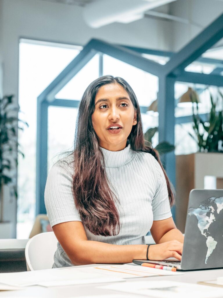 Woman in White Crew Neck T-shirt Sitting on White Chair